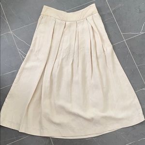Wilfred with linen cream coloured A-line skirt